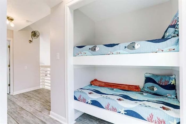 16525 Jamaica Cove Rd, Jamaica Beach, TX 77554 - bedroom featuring baseboards and wood finished floors