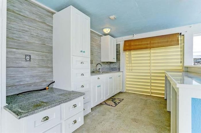 16525 Jamaica Cove Rd, Jamaica Beach, TX 77554 - kitchen featuring white cabinetry, a sink, and tile countertops