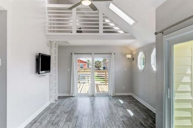 16525 Jamaica Cove Rd, Jamaica Beach, TX 77554 - foyer with baseboards, lofted ceiling, wood finished floors, and a ceiling fan