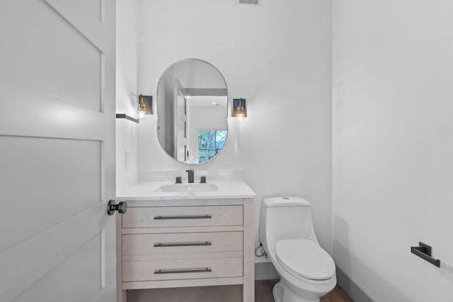 2450 Wickersham Ln Unit 2021, Austin, TX 78741 - bathroom featuring vanity and toilet