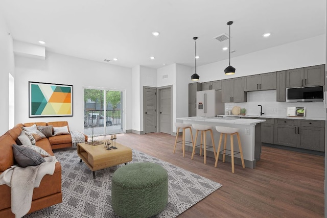 2450 Wickersham Ln Unit 2021, Austin, TX 78741 - living area featuring recessed lighting, wood finished floors, and a high ceiling
