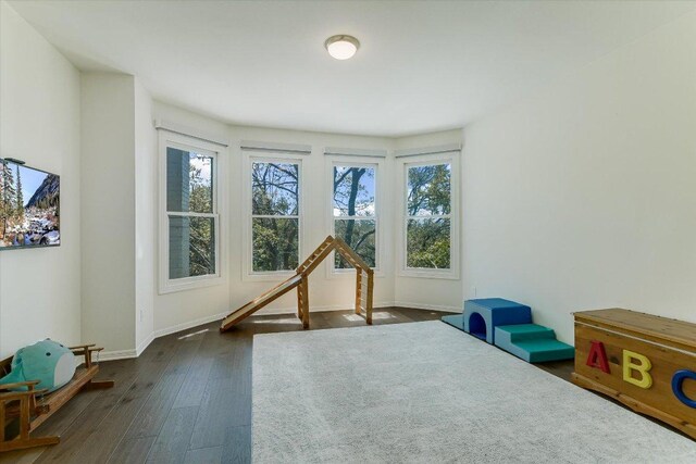 4500 Waterford Pl, Austin, TX 78731 - rec room featuring dark wood-style flooring and baseboards