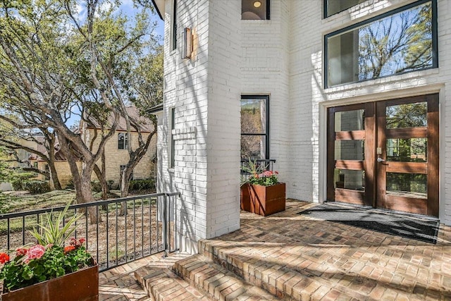 4500 Waterford Pl, Austin, TX 78731 - view of exterior entry featuring brick siding and french doors