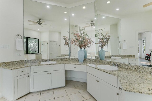 4500 Waterford Pl, Austin, TX 78731 - bathroom featuring a ceiling fan, recessed lighting, double vanity, tile patterned floors, and a shower