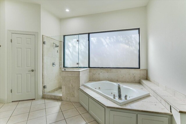 4500 Waterford Pl, Austin, TX 78731 - bathroom featuring a whirlpool tub, a shower stall, and tile patterned flooring