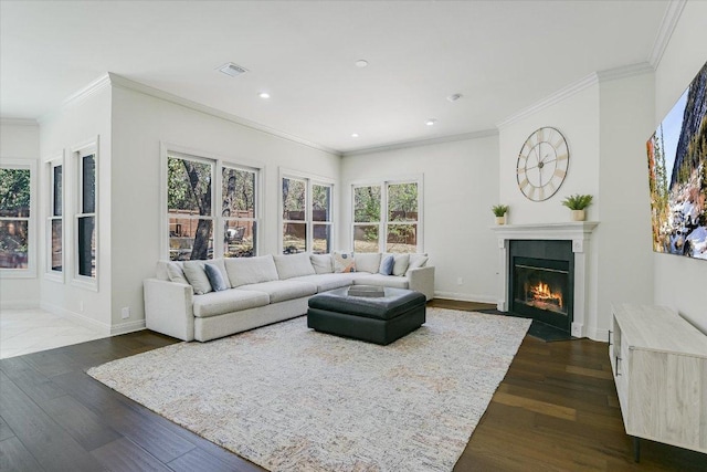 4500 Waterford Pl, Austin, TX 78731 - living area featuring a fireplace with flush hearth, healthy amount of natural light, dark wood-style flooring, ornamental molding, and recessed lighting