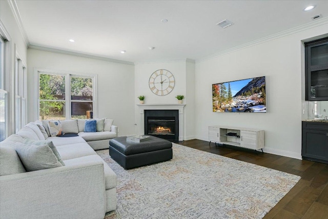 4500 Waterford Pl, Austin, TX 78731 - living area with dark wood-style floors, a fireplace with flush hearth, ornamental molding, and recessed lighting