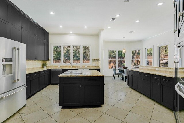 4500 Waterford Pl, Austin, TX 78731 - kitchen with high end refrigerator, dark cabinets, dishwasher, decorative backsplash, and ornamental molding