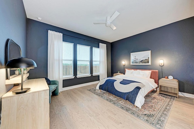 11808 Dillon Falls Dr, Austin, TX 78747 - bedroom with wood finished floors and a ceiling fan