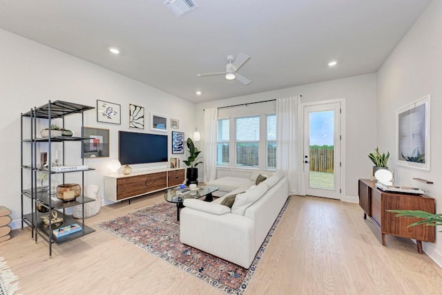 11808 Dillon Falls Dr, Austin, TX 78747 - living room with wood finished floors, ceiling fan, and recessed lighting