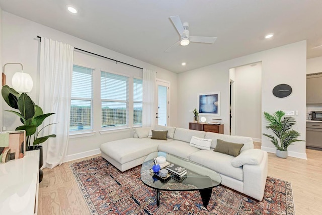 11808 Dillon Falls Dr, Austin, TX 78747 - living room featuring light wood-style floors, a ceiling fan, and recessed lighting