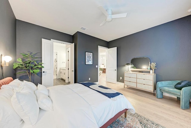 11808 Dillon Falls Dr, Austin, TX 78747 - bedroom with connected bathroom, wood finished floors, and a ceiling fan