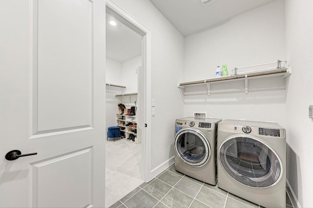 11808 Dillon Falls Dr, Austin, TX 78747 - laundry area with washing machine and clothes dryer and tile patterned floors