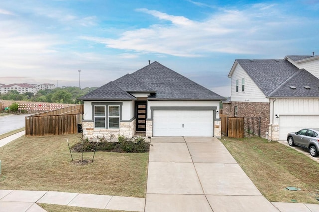 11808 Dillon Falls Dr, Austin, TX 78747 - view of front of house featuring an attached garage, roof with shingles, concrete driveway, and stone siding