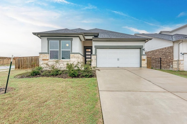 11808 Dillon Falls Dr, Austin, TX 78747 - view of front of home with stone siding, an attached garage, stucco siding, concrete driveway, and roof with shingles