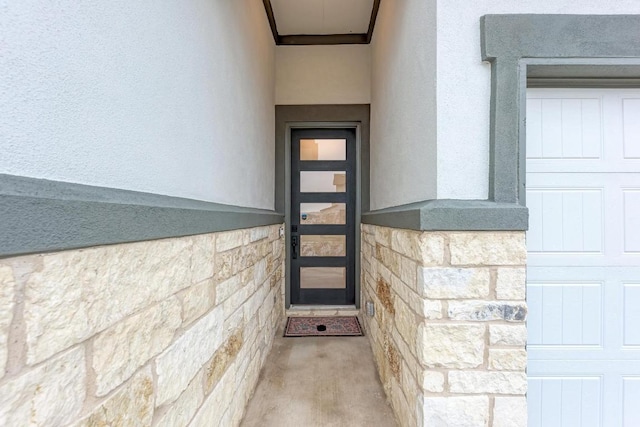 11808 Dillon Falls Dr, Austin, TX 78747 - doorway to property with stucco siding and stone siding