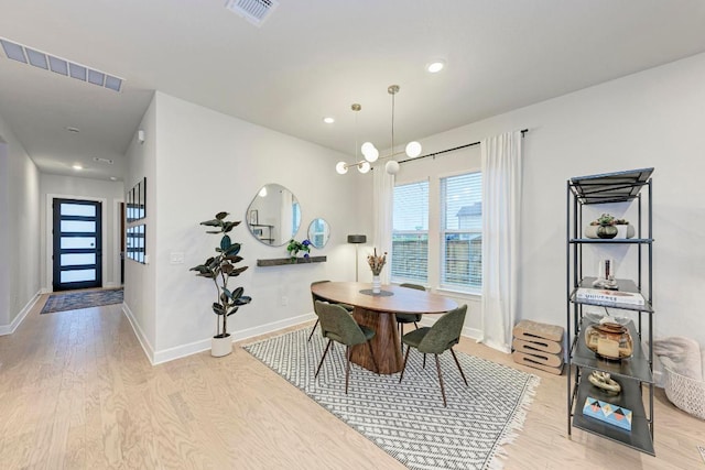 11808 Dillon Falls Dr, Austin, TX 78747 - dining space featuring light wood-style flooring and recessed lighting