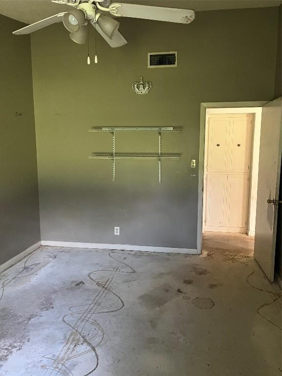 313 Golden Oaks Dr, Georgetown, TX 78628 - empty room with ceiling fan, unfinished concrete flooring, and baseboards
