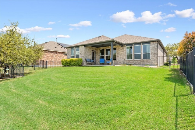 231 Tradinghouse Creek St, Georgetown, TX 78633 - back of house featuring brick siding and roof with shingles