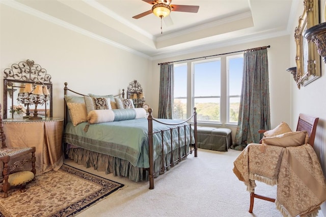 231 Tradinghouse Creek St, Georgetown, TX 78633 - carpeted bedroom with ornamental molding, a raised ceiling, and a ceiling fan