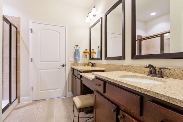 231 Tradinghouse Creek St, Georgetown, TX 78633 - full bath featuring a shower stall, vanity, tile patterned flooring, baseboards, and recessed lighting