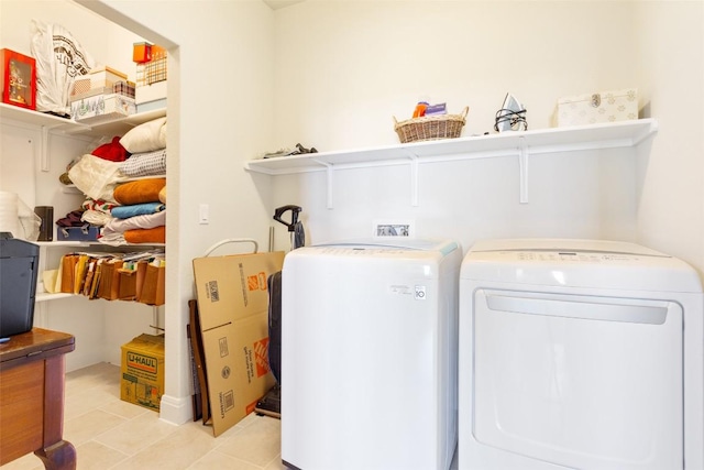 231 Tradinghouse Creek St, Georgetown, TX 78633 - washroom featuring separate washer and dryer and light tile patterned floors