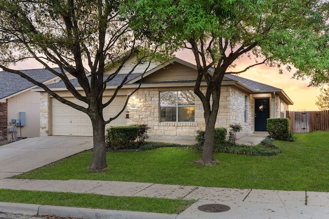 301 Drystone Trl, Liberty Hill, TX 78642 - view of front facade featuring stone siding, driveway, a garage, and a shingled roof