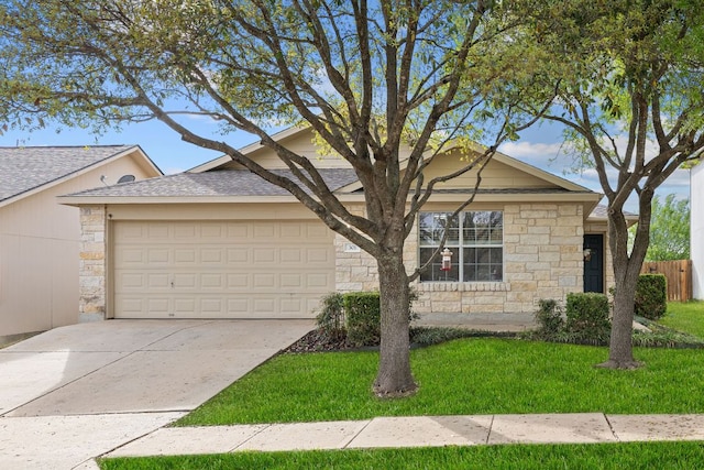 301 Drystone Trl, Liberty Hill, TX 78642 - view of front of home with stone siding, a garage, concrete driveway, and roof with shingles