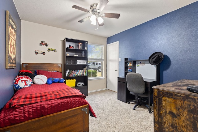 301 Drystone Trl, Liberty Hill, TX 78642 - bedroom with carpet flooring, an office area, and ceiling fan