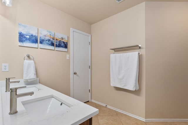 301 Drystone Trl, Liberty Hill, TX 78642 - bathroom featuring tile patterned flooring, baseboards, and double vanity