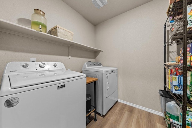 8517 Cantera Ridge Rd, Temple, TX 76502 - laundry room featuring washing machine and dryer, light wood-style flooring, and baseboards