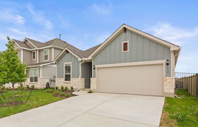 417 Singing Dove Way, Liberty Hill, TX 78642 - craftsman inspired home with board and batten siding, stone siding, concrete driveway, and an attached garage