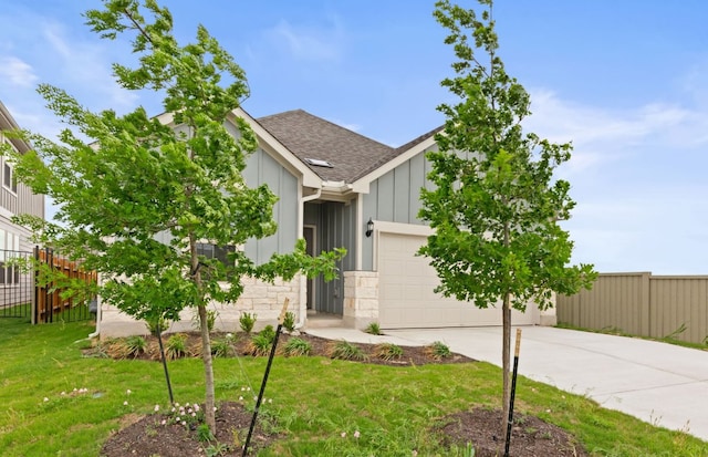 417 Singing Dove Way, Liberty Hill, TX 78642 - view of front of house featuring board and batten siding, a garage, driveway, roof with shingles, and stone siding