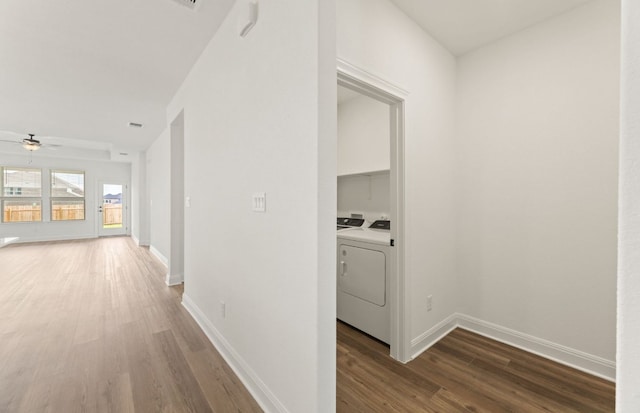 417 Singing Dove Way, Liberty Hill, TX 78642 - hallway featuring wood finished floors, baseboards, and washer and clothes dryer