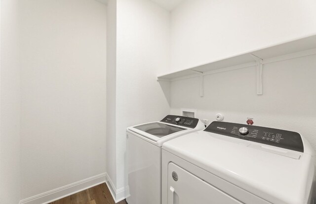 417 Singing Dove Way, Liberty Hill, TX 78642 - washroom featuring dark wood-style floors, washer and clothes dryer, and baseboards