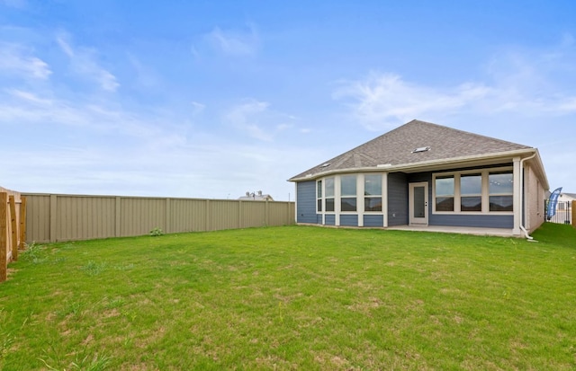 417 Singing Dove Way, Liberty Hill, TX 78642 - rear view of property featuring a fenced backyard and roof with shingles