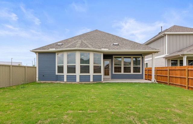 417 Singing Dove Way, Liberty Hill, TX 78642 - back of house with a fenced backyard, roof with shingles, and a patio