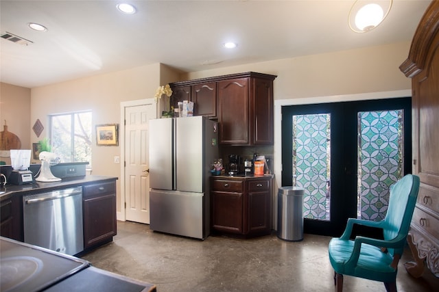 15405 Sutton Dr, Austin, TX 78734 - kitchen with appliances with stainless steel finishes, concrete flooring, dark brown cabinetry, recessed lighting, and dark countertops