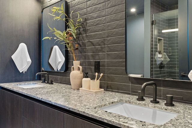 84 E Ave Unit 1904, Austin, TX 78701 - full bathroom with double vanity and tasteful backsplash