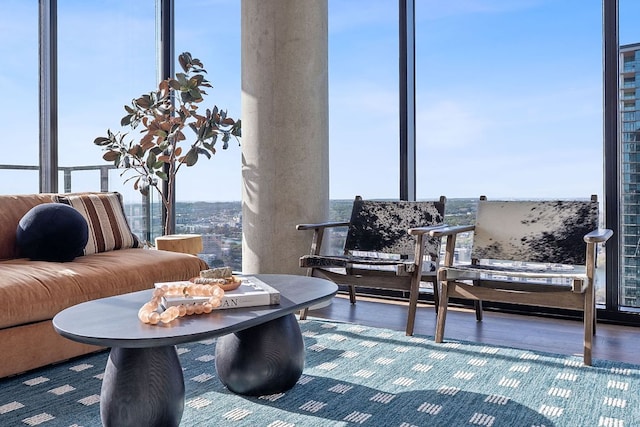84 E Ave Unit 1904, Austin, TX 78701 - living area featuring healthy amount of natural light, wood finished floors, and a wall of windows