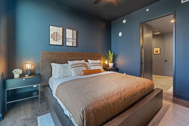 84 E Ave Unit 1904, Austin, TX 78701 - bedroom featuring wood finished floors and a ceiling fan