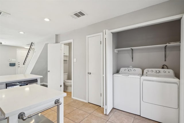 11404 Walnut Ridge Dr Unit 5, Austin, TX 78753 - washroom with washing machine and dryer, light tile patterned flooring, and recessed lighting