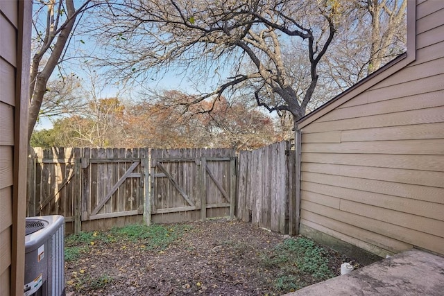 11404 Walnut Ridge Dr Unit 5, Austin, TX 78753 - view of yard featuring central air condition unit and a gate