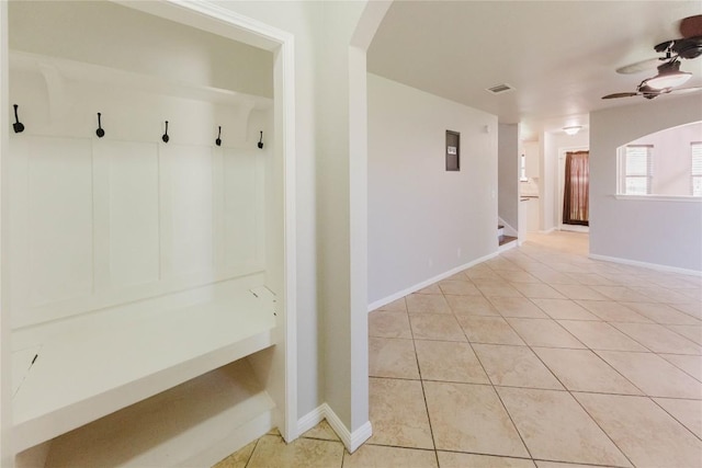 115 Hummingbird Ct, Cedar Creek, TX 78612 - mudroom featuring ceiling fan, light tile patterned flooring, arched walkways, and baseboards