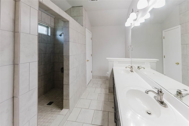 115 Hummingbird Ct, Cedar Creek, TX 78612 - full bath featuring double vanity, a walk in shower, tile patterned floors, and toilet
