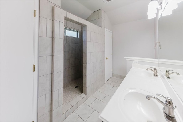 115 Hummingbird Ct, Cedar Creek, TX 78612 - full bathroom with a walk in shower, double vanity, tile patterned flooring, and lofted ceiling