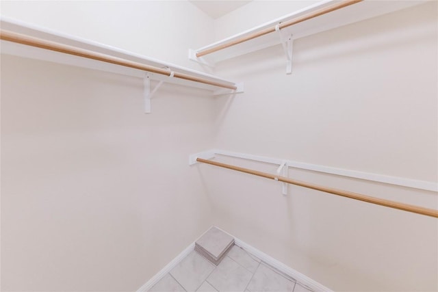 115 Hummingbird Ct, Cedar Creek, TX 78612 - spacious closet with light tile patterned floors