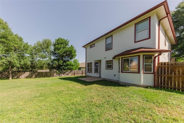 115 Hummingbird Ct, Cedar Creek, TX 78612 - back of property with stucco siding