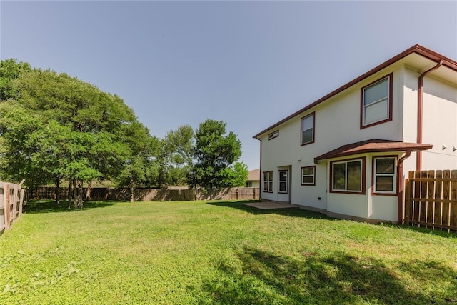 115 Hummingbird Ct, Cedar Creek, TX 78612 - rear view of property featuring stucco siding
