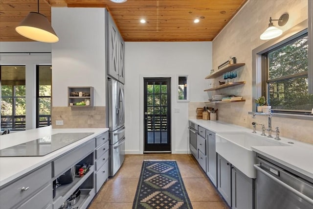3805 Turkey Creek Dr, Austin, TX 78730 - kitchen with wooden ceiling, appliances with stainless steel finishes, gray cabinets, and open shelves